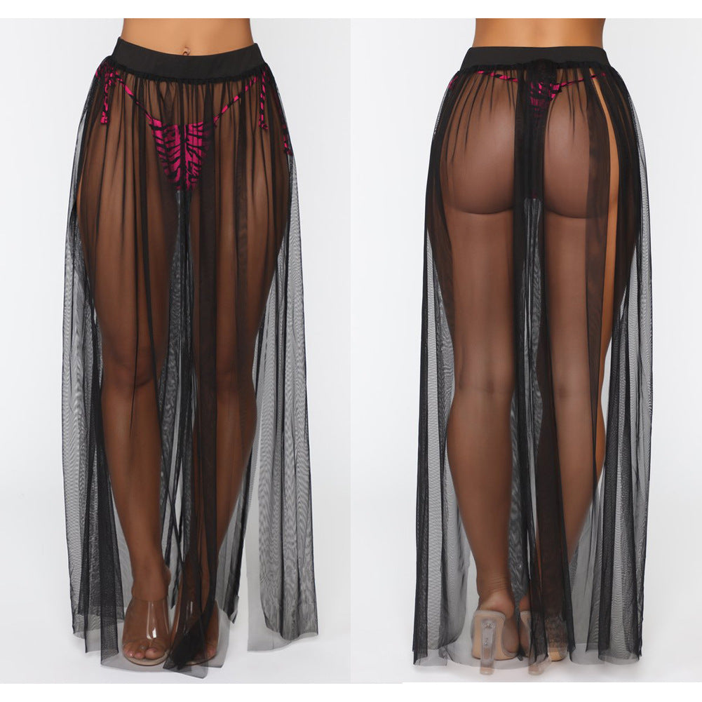 Black sheer skirt with pink accents worn by a model on a white background