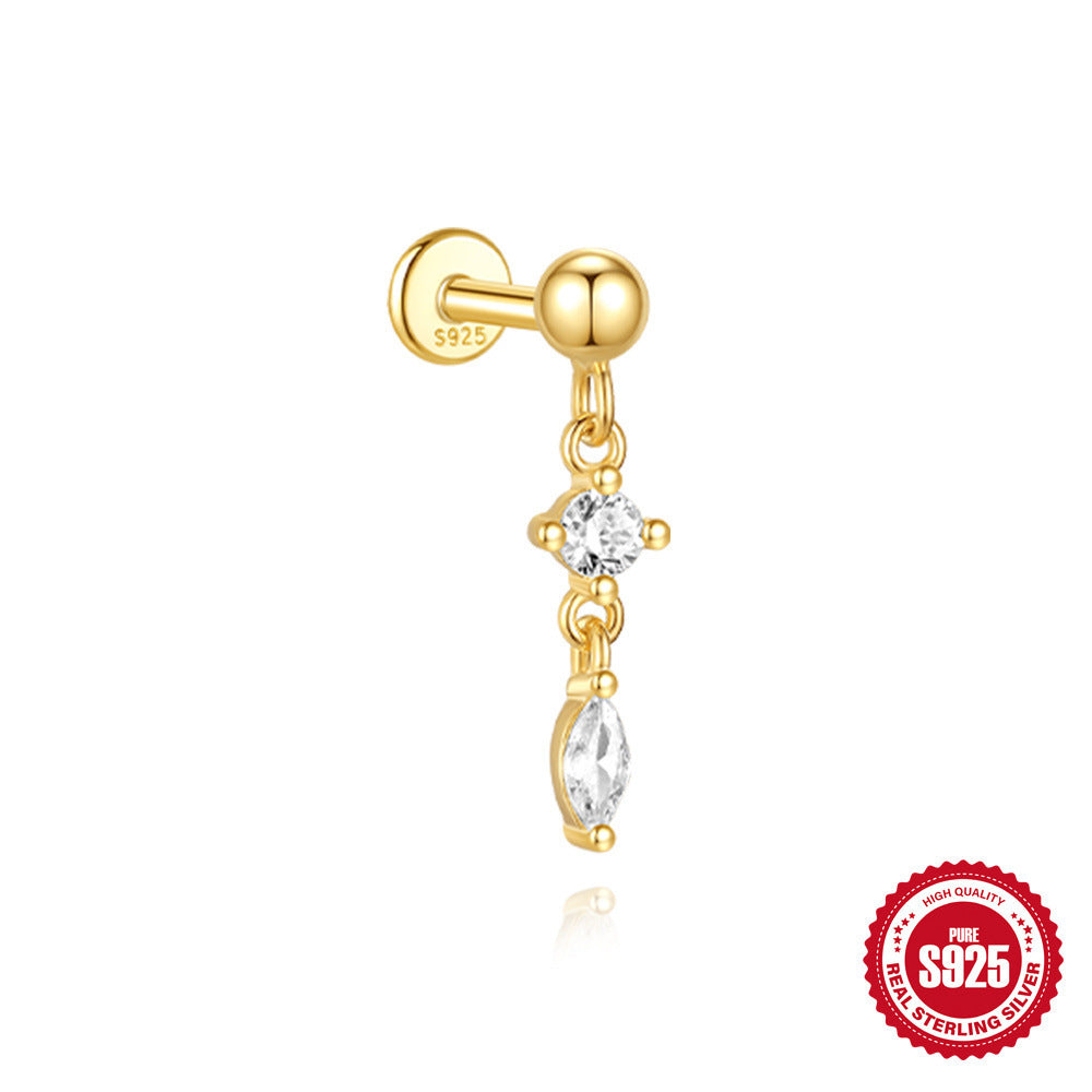 Gold earring with a clear gemstone on a white background