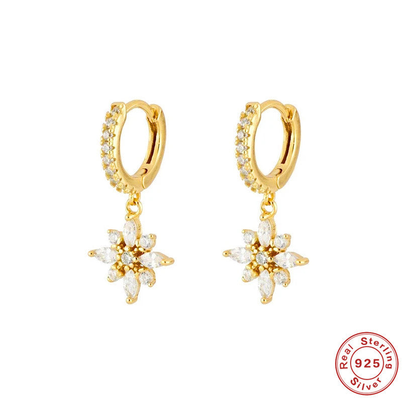 Gold hoop earrings with floral style drops on a white background, featuring 'Real Sterling Silver 925' stamp.