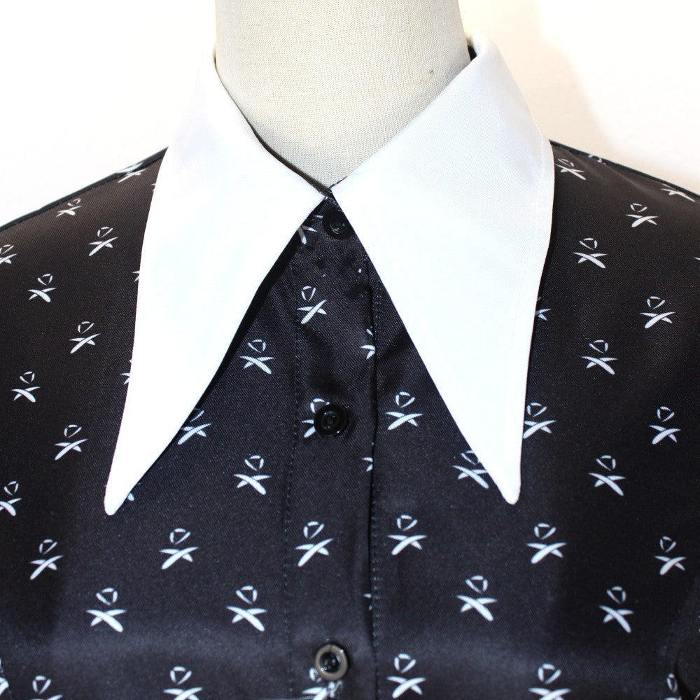 Black patterned dress with collar on a mannequin