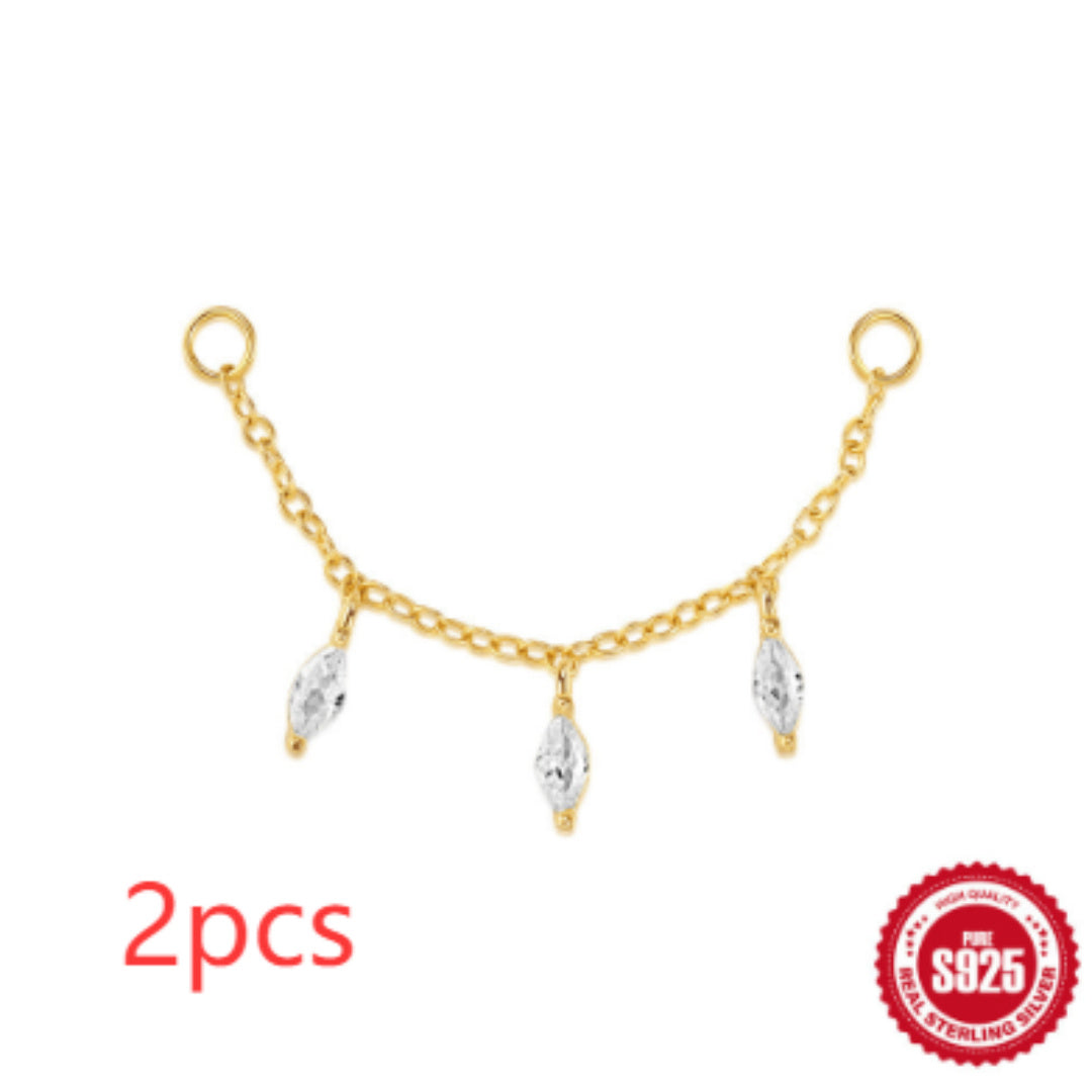 Gold chain with three silver pendants on a white background, featuring '925' stamp.