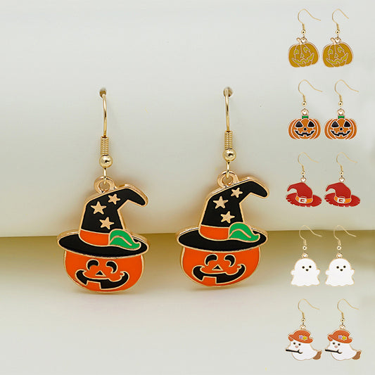 Halloween-themed earrings including witch hats, pumpkins, ghosts, and skeletons on a white background.