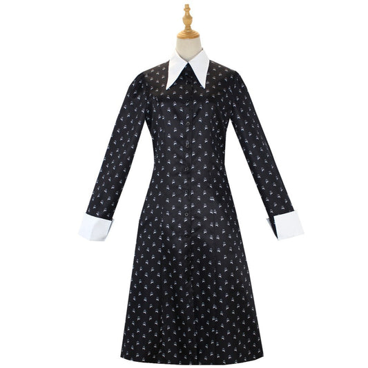 Black dress with white floral pattern on a mannequin against a white background